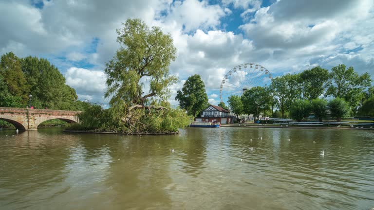 Bancroft Gardens and River Avon in Stratford-upon-Avon in the daytime with moving clouds, 4k time-lapse