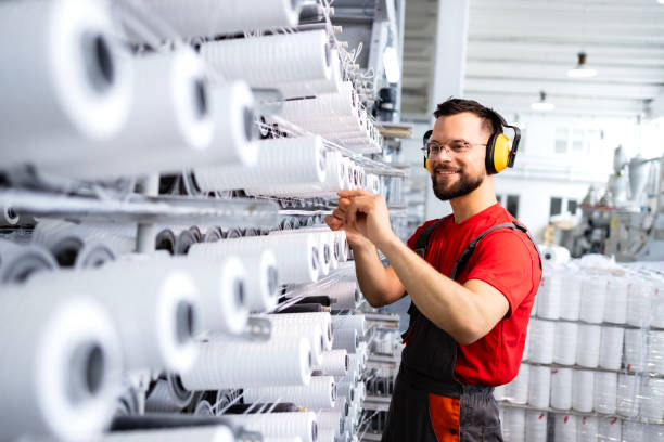 Working in textile factory production line.