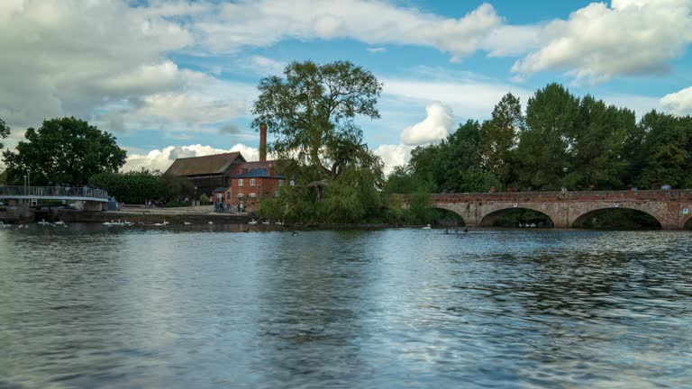 View of Bancroft Gardens and River Avon with blue sky and moving clouds in Stratford-upon-Avon, - 4k time-lapse