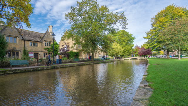 Tranquil scene of Bourton-on-the-Water in Cotswolds, Gloucestershire, England - 4k time-lapse (tilt up)
