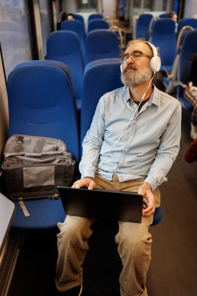 istock Mature man relaxing while traveling by train 2090896451
