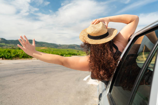 istock oman leaning out of her car window 2090901635