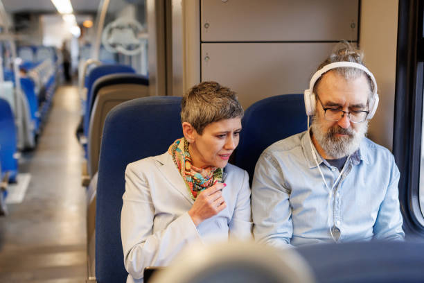 istock Mature couple using laptop while traveling by train 2090908394