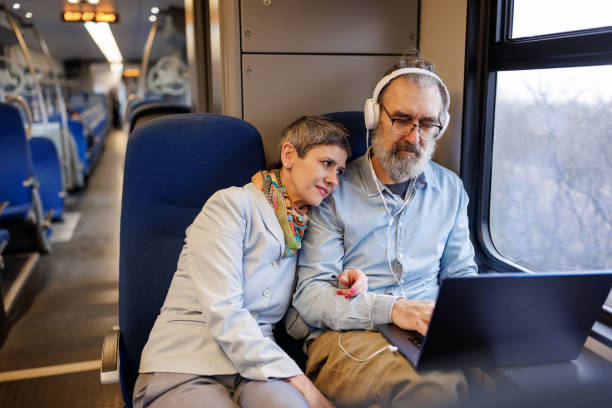 istock Mature business couple using laptop while traveling by train 2090918205