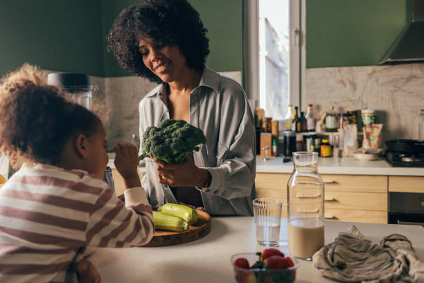 istock Mother and Child Preparing Healthy Meal Together in Kitchen 2090969113