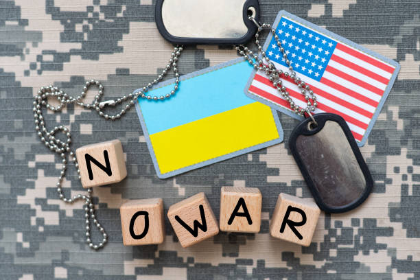 istock Ukrainian army flag patch and military ID tags on camouflage uniform no war 2090987643