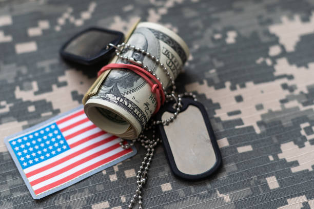 istock Military ID tags and US army patches on camouflage background 2091025704