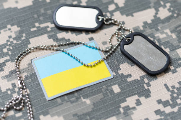 istock Military ID tags and patch on pixel Ukrainian camouflage, closeup 2091029332
