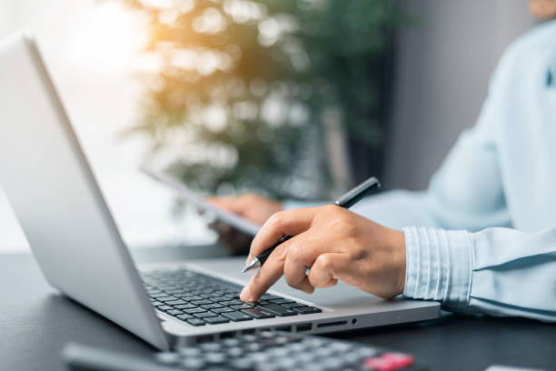 istock Business woman working on documents looking concentrated with briefcase on table. Businesswoman is deeply reviewing a financial report for a return on investment or investment risk analysis. 2091031934