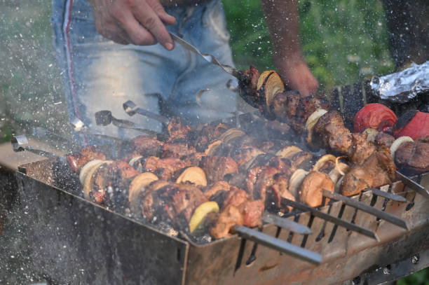 istock A man is cooking a barbecue on the grill. 2091032970