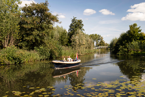 Abcoude, Netherlands, September 14, 2019; People enjoy a boat trip on the river Het Gein.
