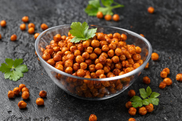 istock Roasted spicy chickpeas in bowl. Healthy snack. 2091063494