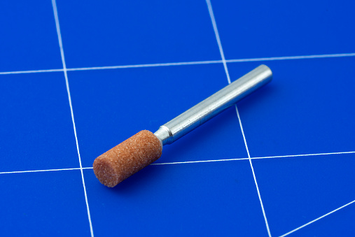 Rotary Tool for Grinding and Sharpening on blue cutting mat.