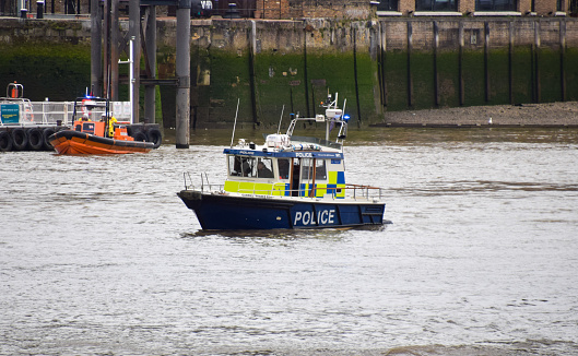 London, UK - April 8 2022: A police boat on patrol in the River Thames