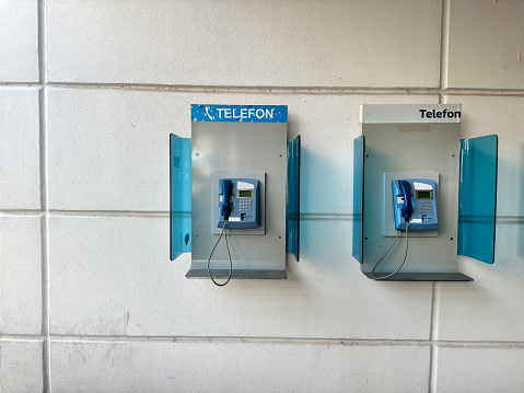 Pair of payphone booth in Vienna center street. Two modern public phones on european city street. copyspace.