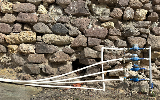 Close up tubes on exterior of building wall