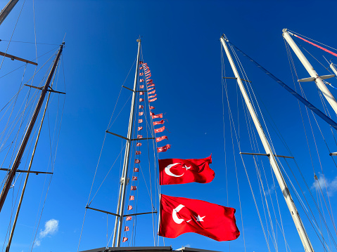 Close up mast sailboats over sky at marina in Foca, Izmir, Aegean Turkey
