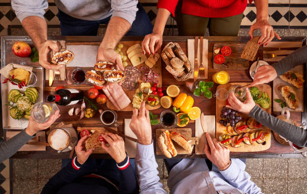 istock Faceless people sharing assortment of snacks 2091085261