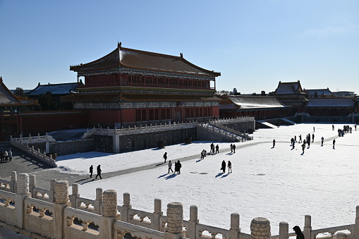 Beijing, China - December 19 2023: Creative shots of the Forbidden City of China, against an ancient Chinese culture, shot during winter where rivers were iced and snow are everywhere on the ground