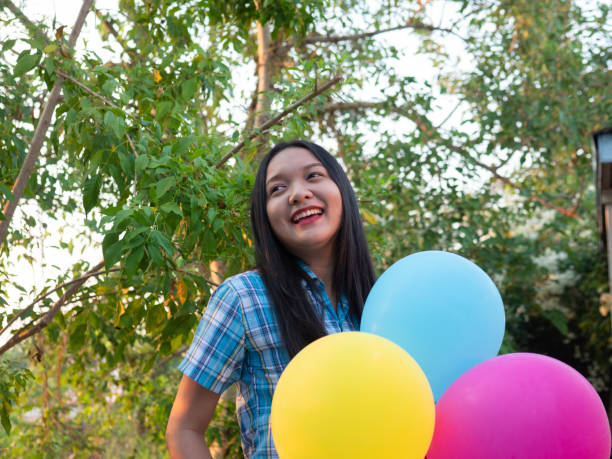 Smily girl hold balloon on party.