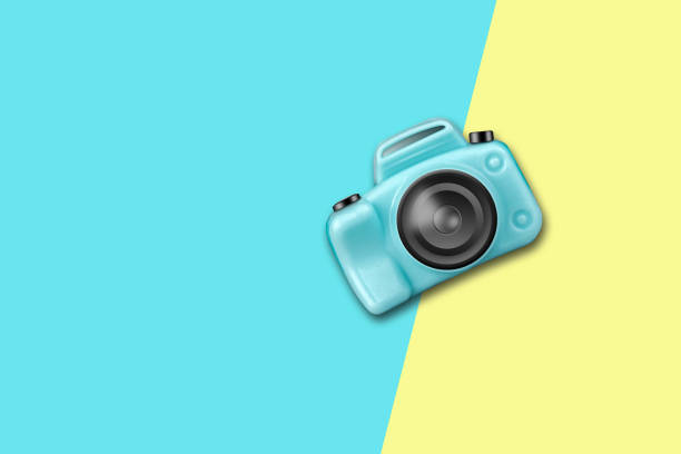 Blue plastic camera on a yellow blue background. Copy space.Travel concept. Travel background.