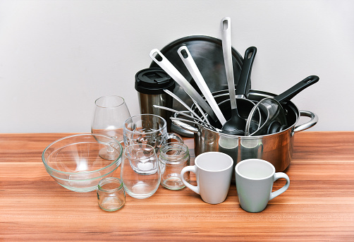 Metal and glass cooking kitchen utensils on table. Domestic kitchenware collection tool.