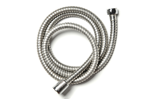 Plumbing metal flexible water hose tube twisted into a ring