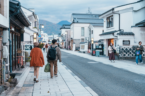 Tourists sightseeing at Matsumoto Nakamachi Street is known for its traditional storehouses, called kura. Japanese handicraft shopping. Landmark for tourist attraction. Nagano, Japan, 12 November 2023