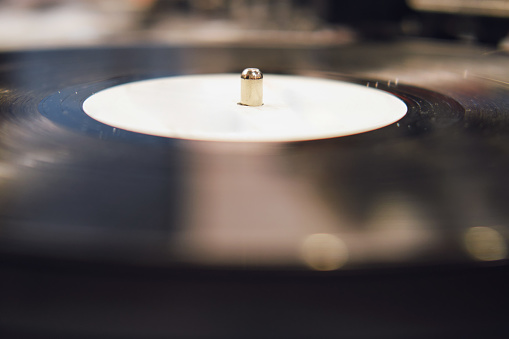 Vintage vinyl record player in close up view with shallow depth of field