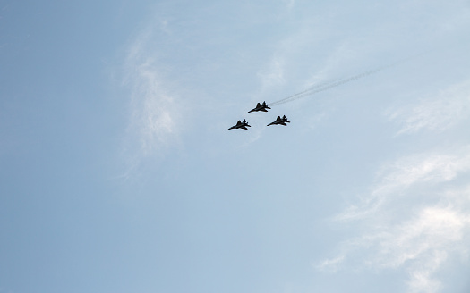 Kyiv, Ukraine - August 22, 2021: Group of flying military aircrafts MIG-29 during parade dedicated to Independence Day of Ukraine.