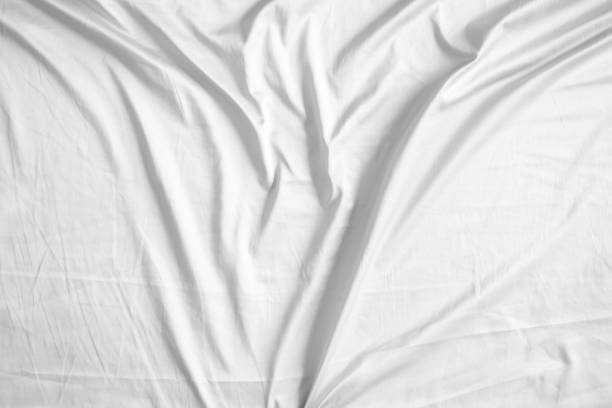 istock Abstract white wrinkled bedding sheet fabric texture background 2091296955