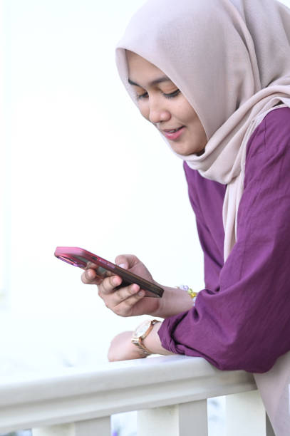 istock A Muslim woman uses smartphone technology 2091309303