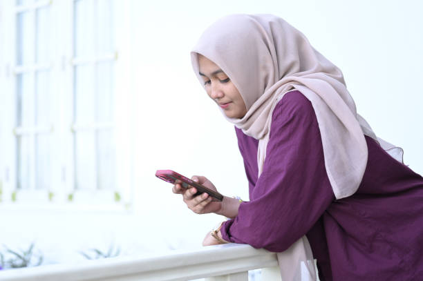 istock A Muslim woman uses smartphone technology 2091314198