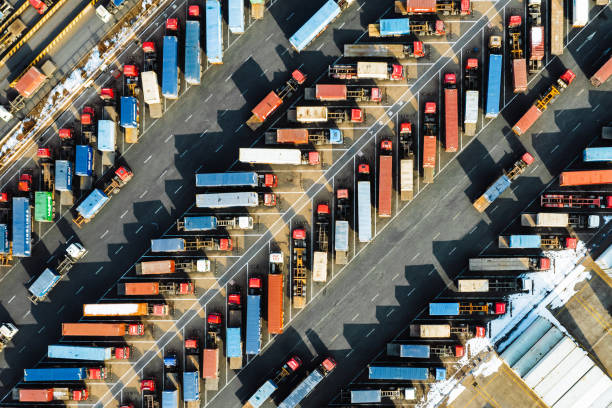 istock Aerial View, Rows of Trucks Driving in Harbor with Trailers 2091314718
