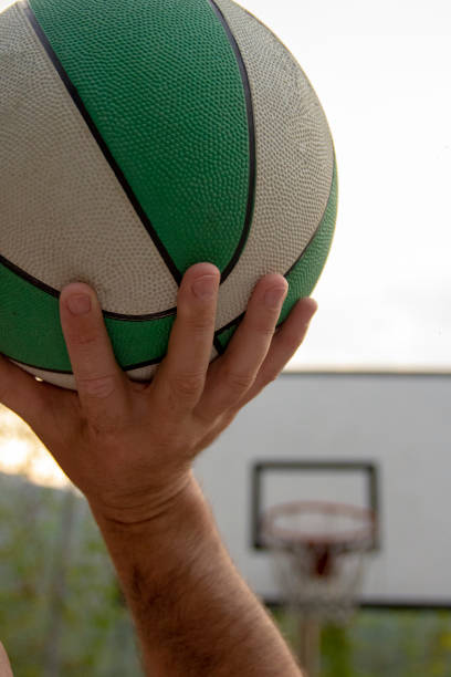 istock Man Holding a Basketball Ball 2091314826