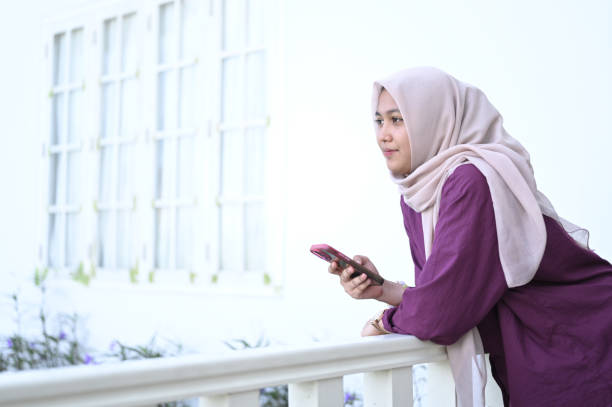 istock A Muslim woman uses smartphone technology 2091317277