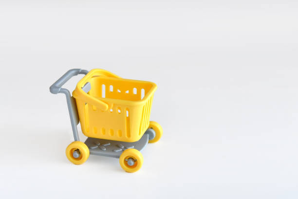 istock Empty yellow mini shopping cart or store trolley 2091327000