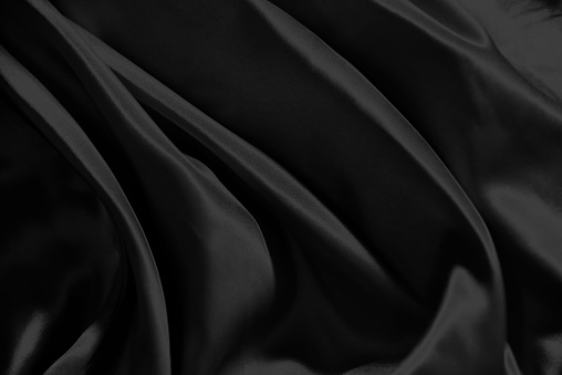 Black silk soft fabric wave of textile background