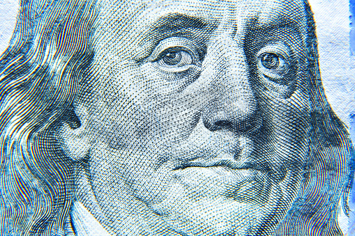Portrait of Benjamin Franklin 100 American dollar banknote hyper macro