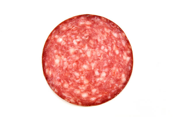 istock Sausage salami round piece on white background isolated. 2091336933