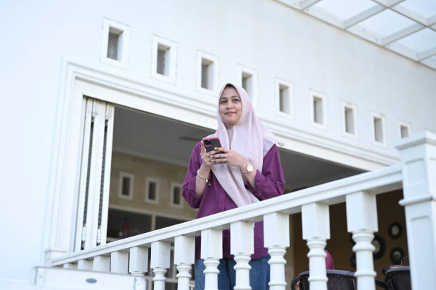 istock Young Muslim Woman Using Mobile Phone 2091340631