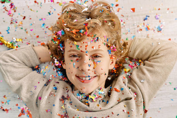 istock Positive kid strewn with confetti 2091406471