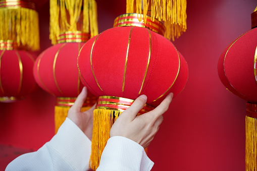 Close-up of hand holding red lantern