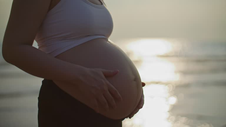 Pregnant woman on beach