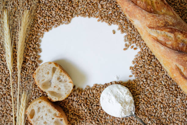 Bread and flour on a rustic wooden table. Bakery and grocery food store concept.