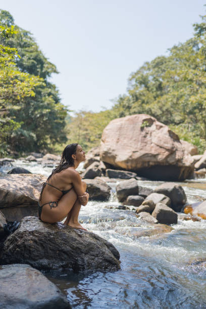 istock Young woman looks across river 2091481266