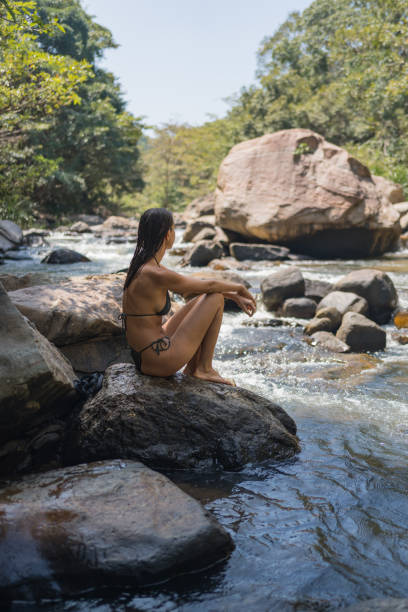 istock Young woman looks across river 2091481794