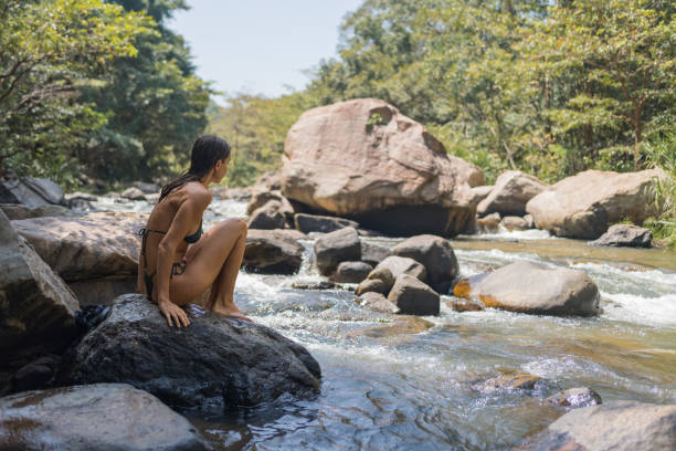 istock Young woman looks across river 2091481801