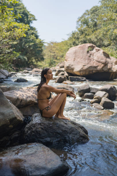 istock Young woman looks across river 2091481811