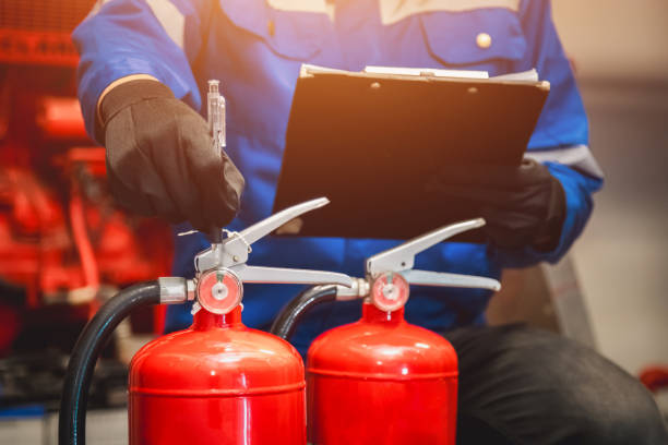 istock Engineer check fire extinguisher tank in the fire control room for safety in factory or industry. 2091536403